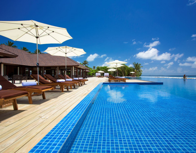 Atmosphere-Kanifushi---loungers-at-main-pool-(2).jpg